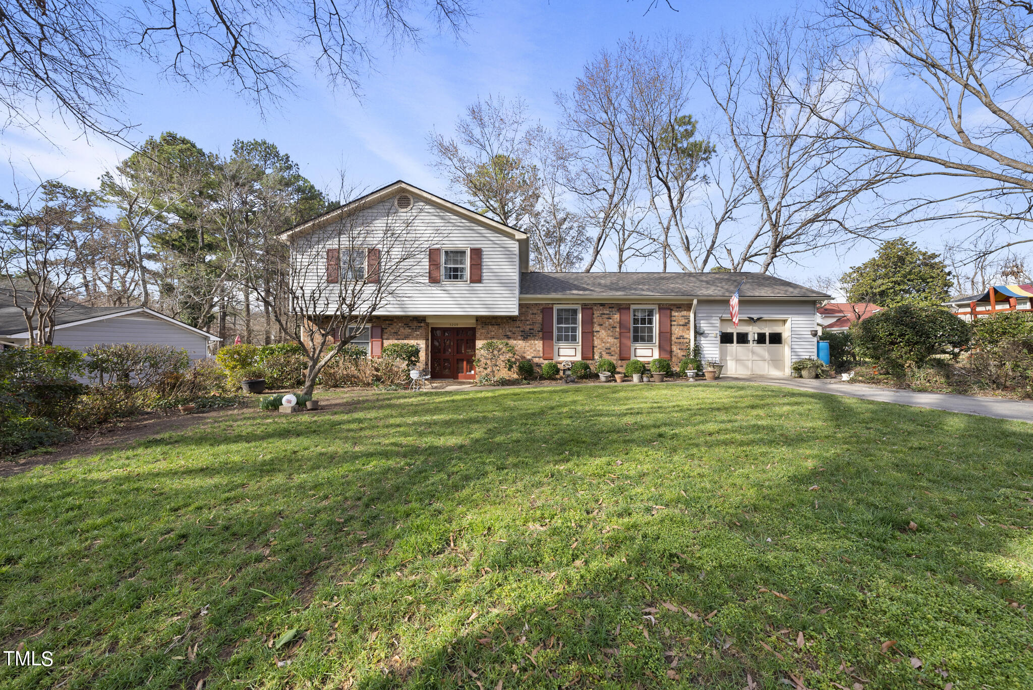 5209 Fireside Drive Raleigh, NC 27609 - Photo 2 of 33 a view of a house with a yard