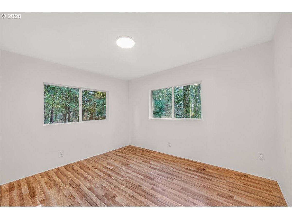 32231 Bishop Road Rainier, OR 97048 - Photo 17 of 26 an empty room with wooden floor and windows