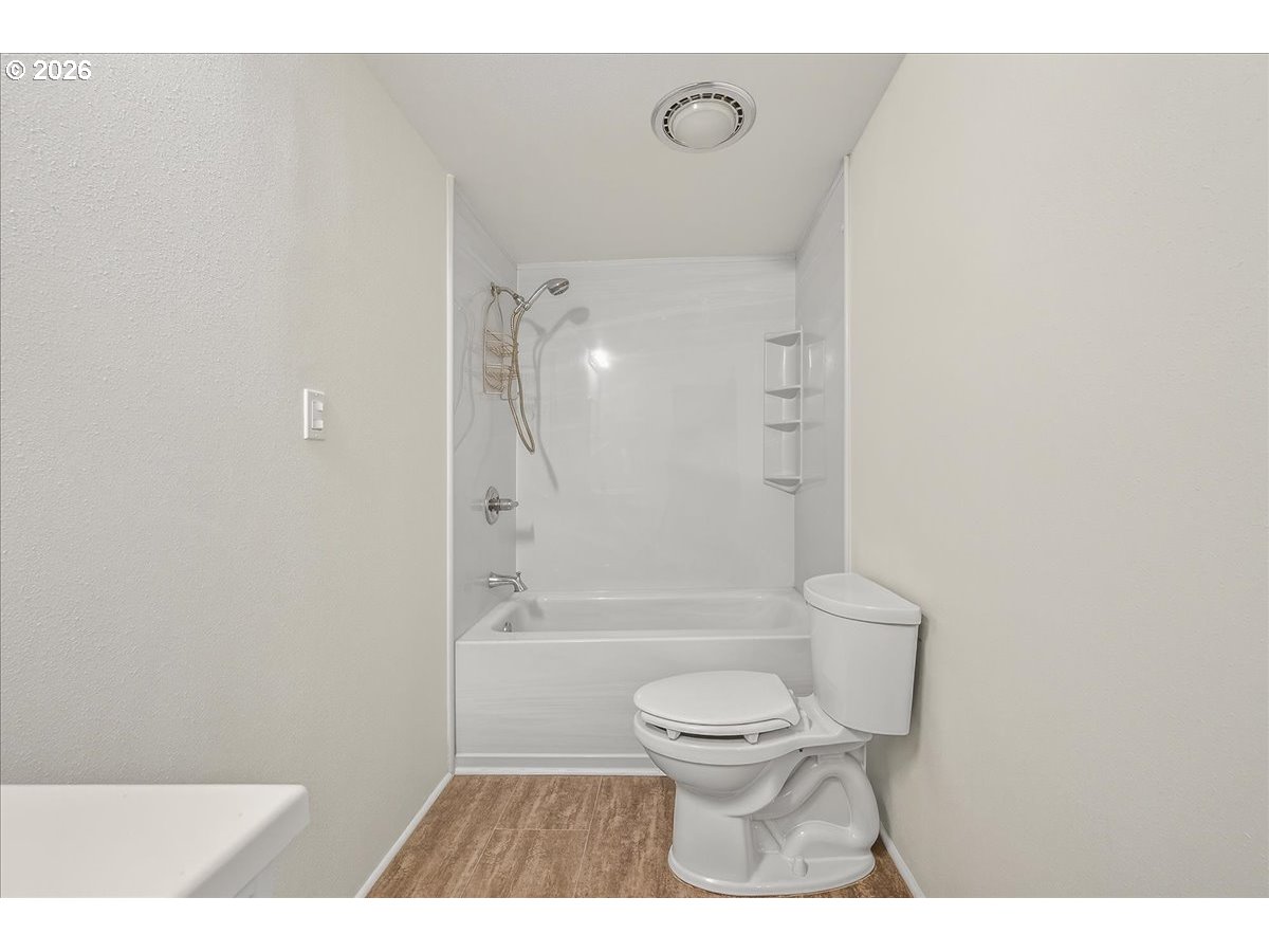 32231 Bishop Road Rainier, OR 97048 - Photo 24 of 26 a bathroom with a toilet a sink and a bathtub