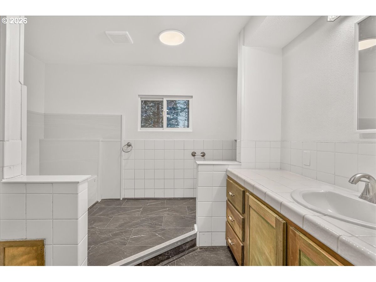 32231 Bishop Road Rainier, OR 97048 - Photo 25 of 26 a bathroom with a sink a toilet and shower