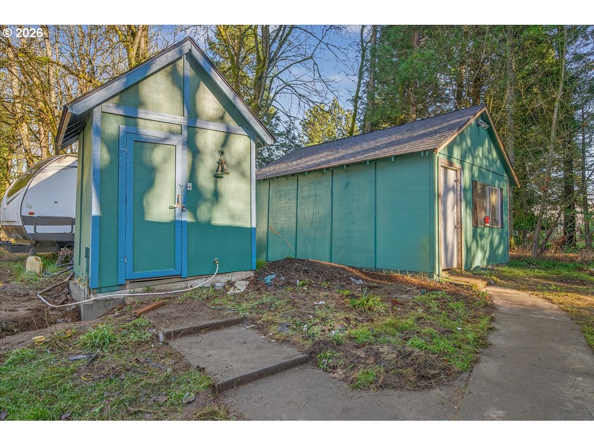32231 Bishop Road Rainier, OR 97048 - Photo 4 of 26 a view of a house with a small yard and floor to ceiling window
