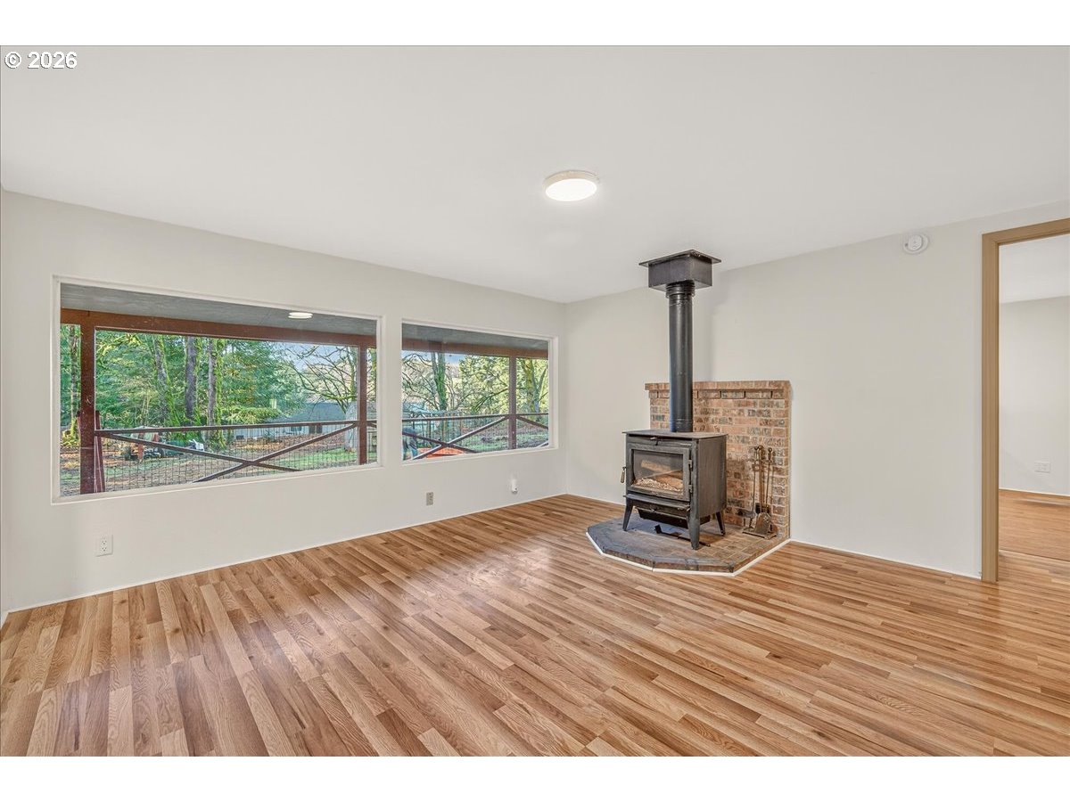 32231 Bishop Road Rainier, OR 97048 - Photo 7 of 26 a living room with a wooden floor
