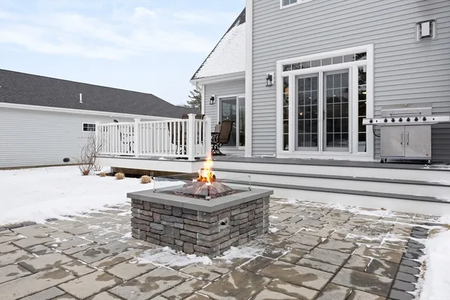 a front view of a house with sitting area