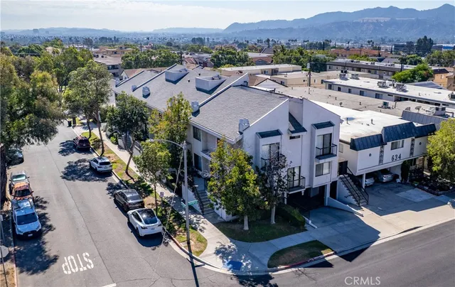 an aerial view of residential houses and outdoor space