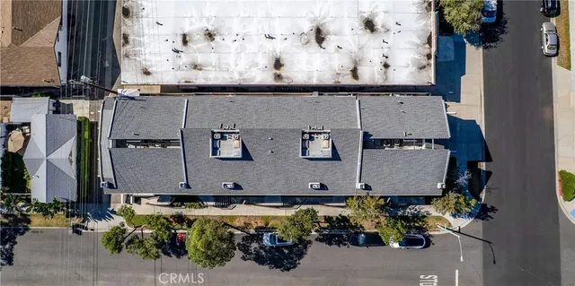 an aerial view of residential house with a yard