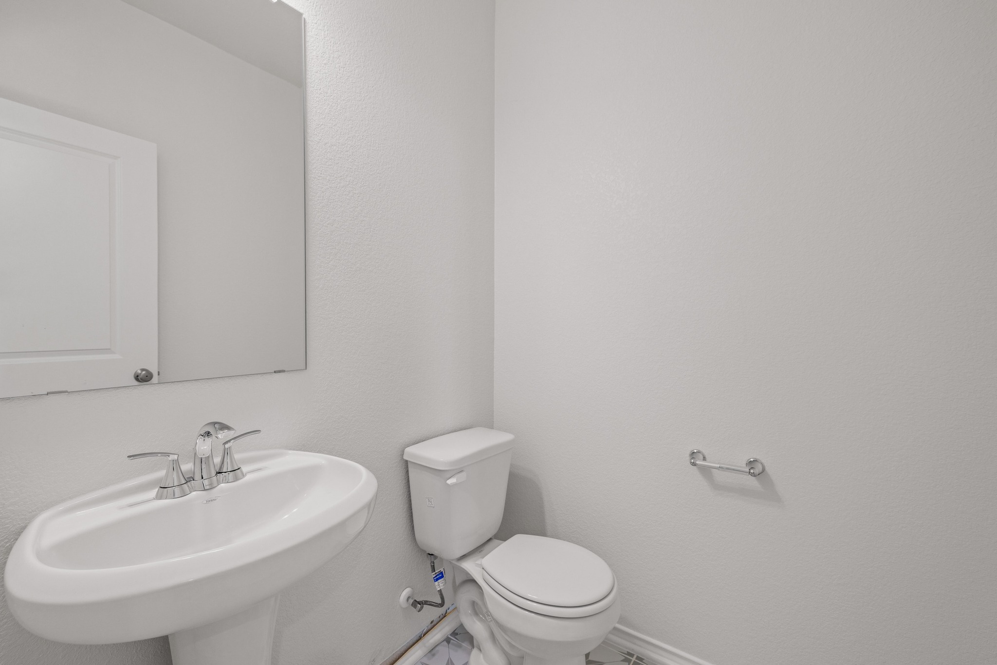161 Lucky Texan Road Jarrell, TX 76537 - Photo 17 of 32 a bathroom with a sink a toilet and mirror