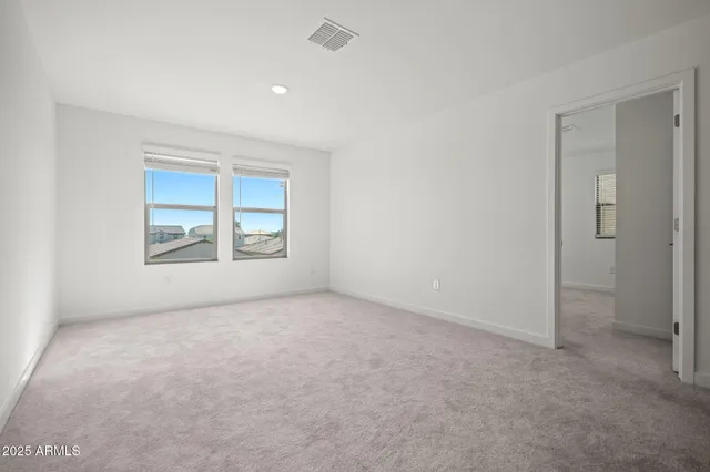 a view of an empty room and window