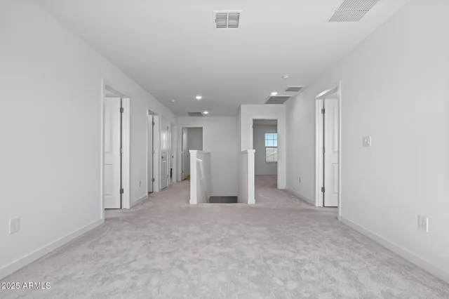 a bathroom with double sink and a mirror
