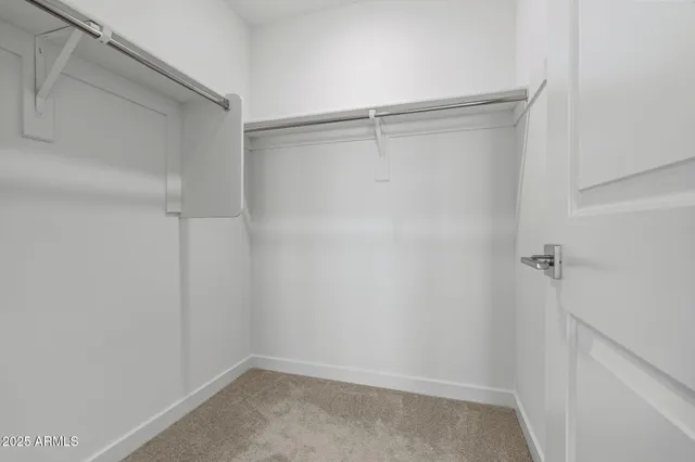 a kitchen with granite countertop a sink stove and wooden floor