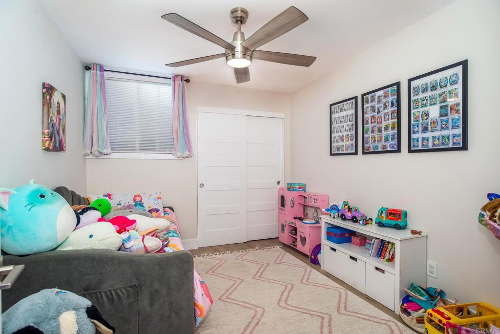 4776-78 Del Monte Avenue San Diego, CA 92107 - Photo 14 of 45 a bedroom with a bed and furniture