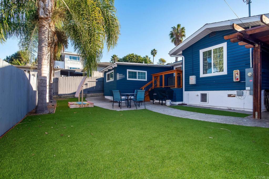 4776-78 Del Monte Avenue San Diego, CA 92107 - Photo 21 of 45 a front view of house with yard and outdoor seating