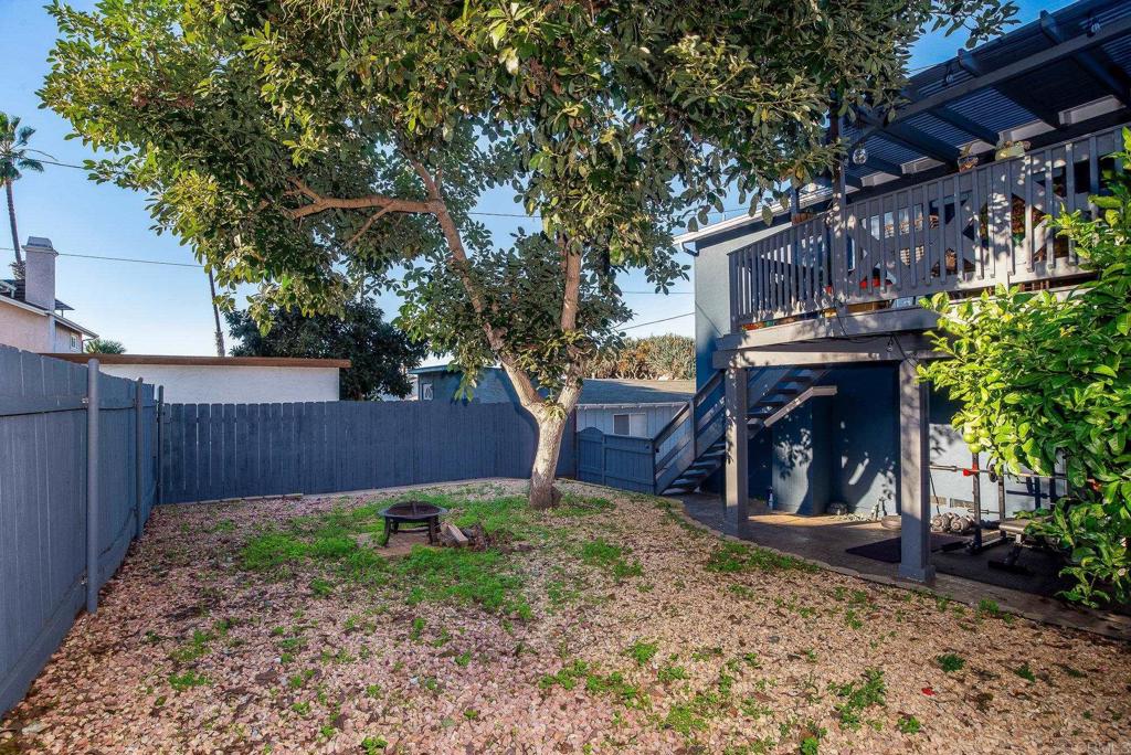 4776-78 Del Monte Avenue San Diego, CA 92107 - Photo 27 of 45 a view of a backyard with a small cabin and a chair