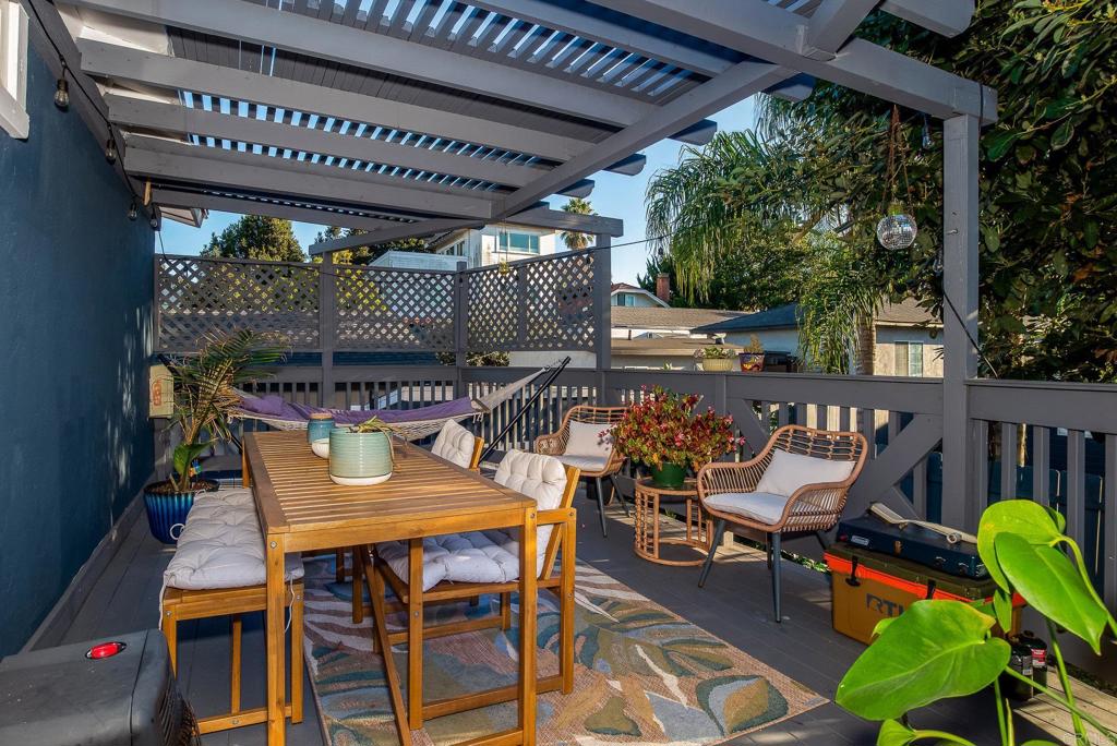 4776-78 Del Monte Avenue San Diego, CA 92107 - Photo 29 of 45 a view of a chairs and table in patio with a barbeque