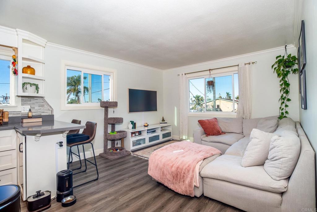 4776-78 Del Monte Avenue San Diego, CA 92107 - Photo 31 of 45 a bedroom with furniture and a flat screen tv