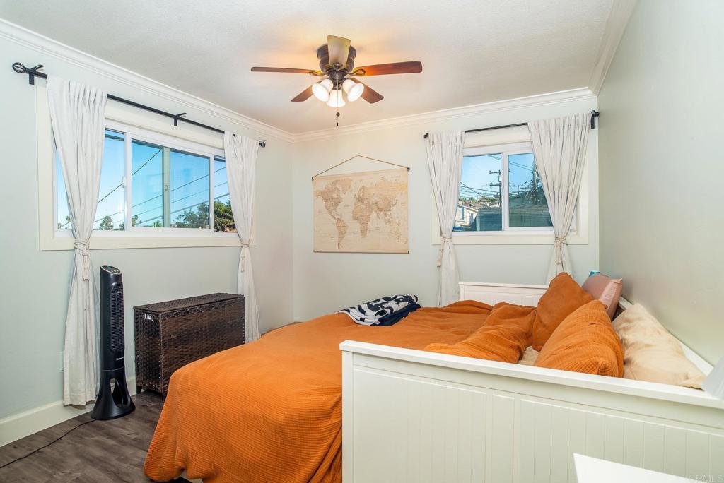 4776-78 Del Monte Avenue San Diego, CA 92107 - Photo 36 of 45 a bed room with a bed and a fireplace