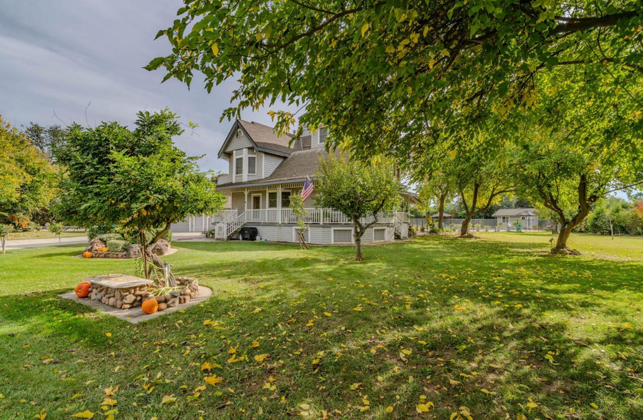 22140 North Clements Clements, CA 95227 - Photo 12 of 88 a house with huge green field in front of it