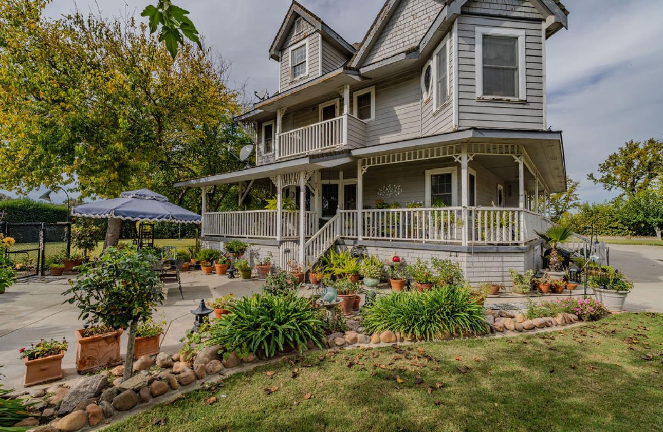 22140 North Clements Clements, CA 95227 - Photo 19 of 88 a front view of a house with a yard and outdoor seating
