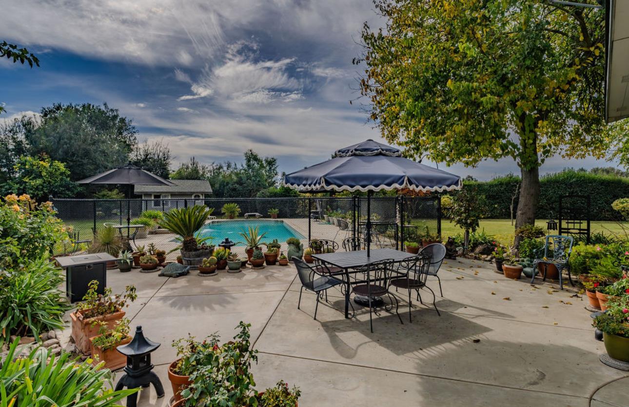 22140 North Clements Clements, CA 95227 - Photo 23 of 88 an outdoor space with patio furniture and umbrella