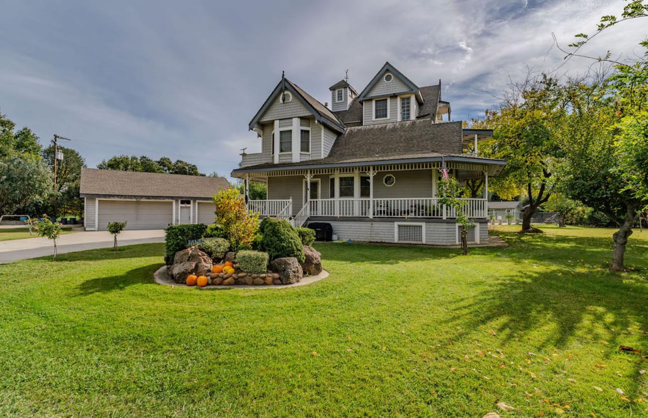 22140 North Clements Clements, CA 95227 - Photo 4 of 88 a front view of a house with a garden
