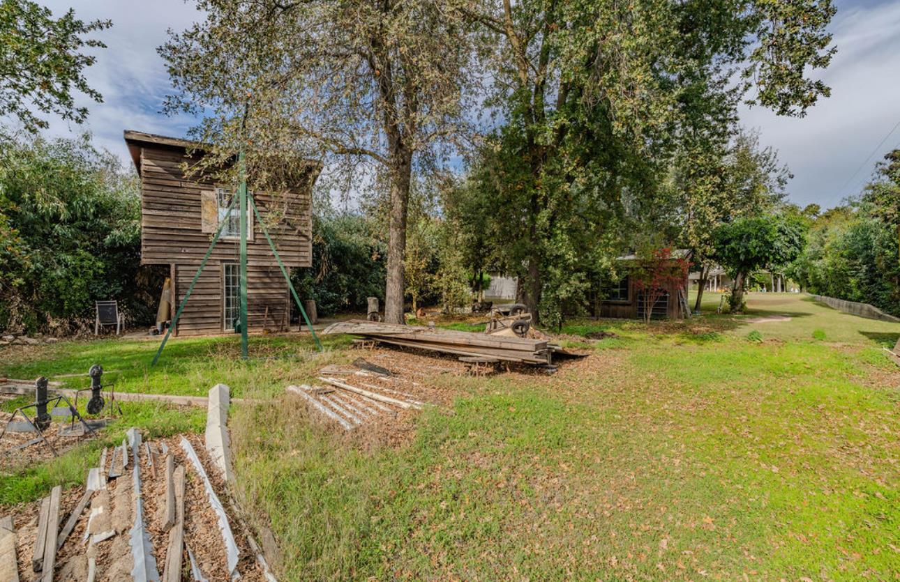 22140 North Clements Clements, CA 95227 - Photo 42 of 88 a view of a swimming pool with a bench and some trees