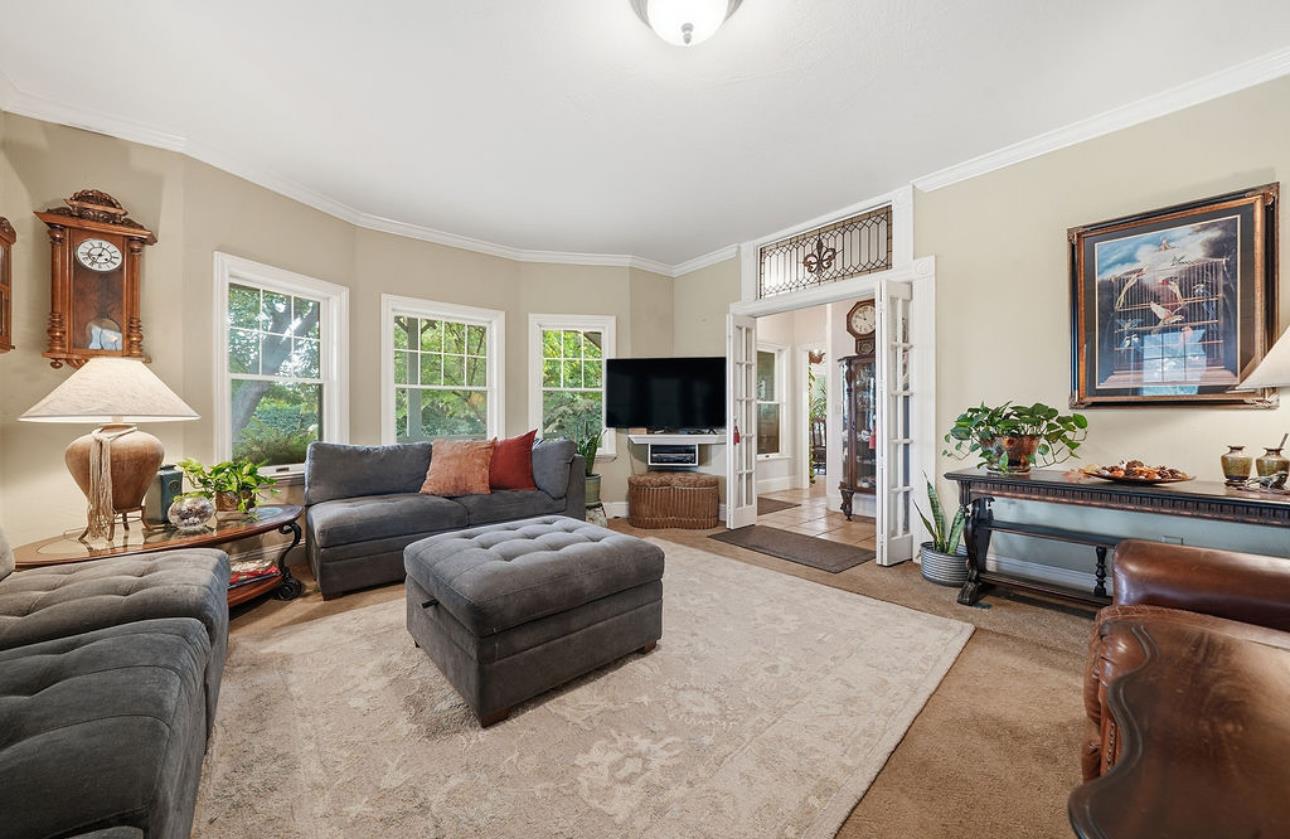 22140 North Clements Clements, CA 95227 - Photo 54 of 88 a living room with furniture a flat screen tv and a large window