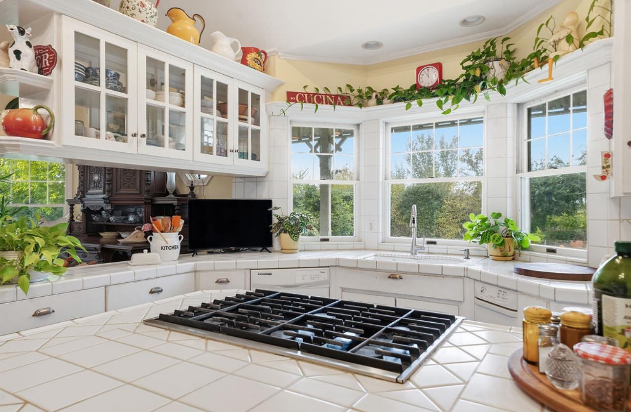 22140 North Clements Clements, CA 95227 - Photo 62 of 88 a kitchen with a stove a sink and a microwave