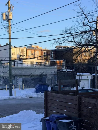 a view of a street with sitting area