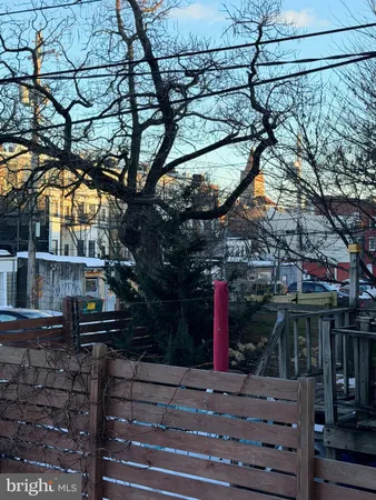 a view of a house with a tree