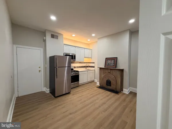 a view of kitchen appliances and a refrigerator
