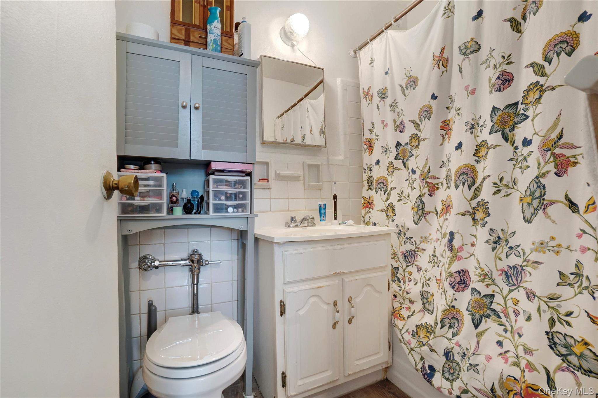 50-22 40th Street, Unit 5A Queens, NY 11104 - Photo 6 of 13 a bathroom with a sink toilet and shower