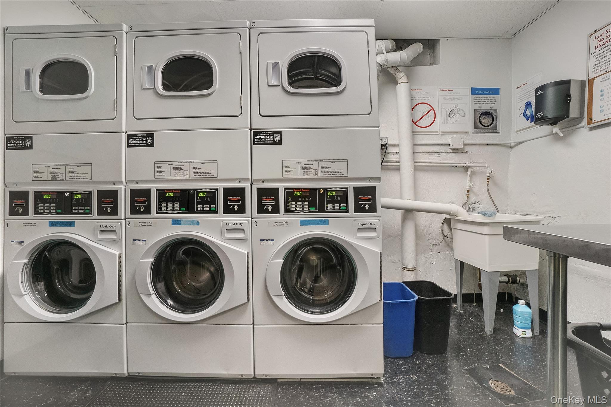 50-22 40th Street, Unit 5A Queens, NY 11104 - Photo 7 of 13 a utility room with dryer and washer