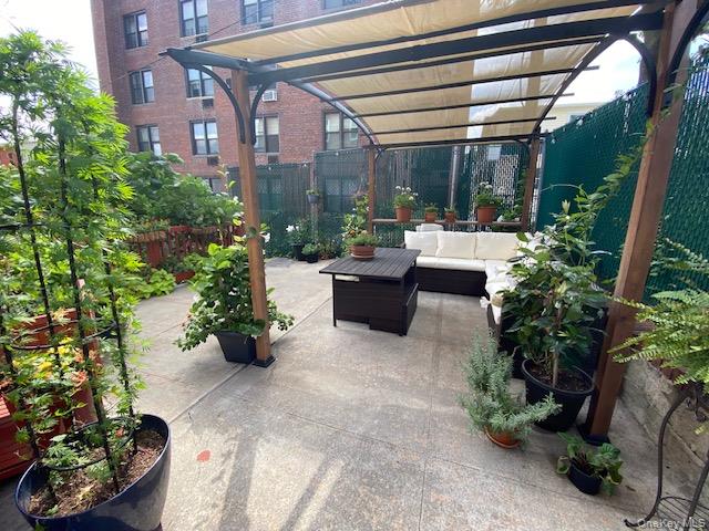 50-22 40th Street, Unit 5A Queens, NY 11104 - Photo 9 of 13 a view of a chairs and table in a patio
