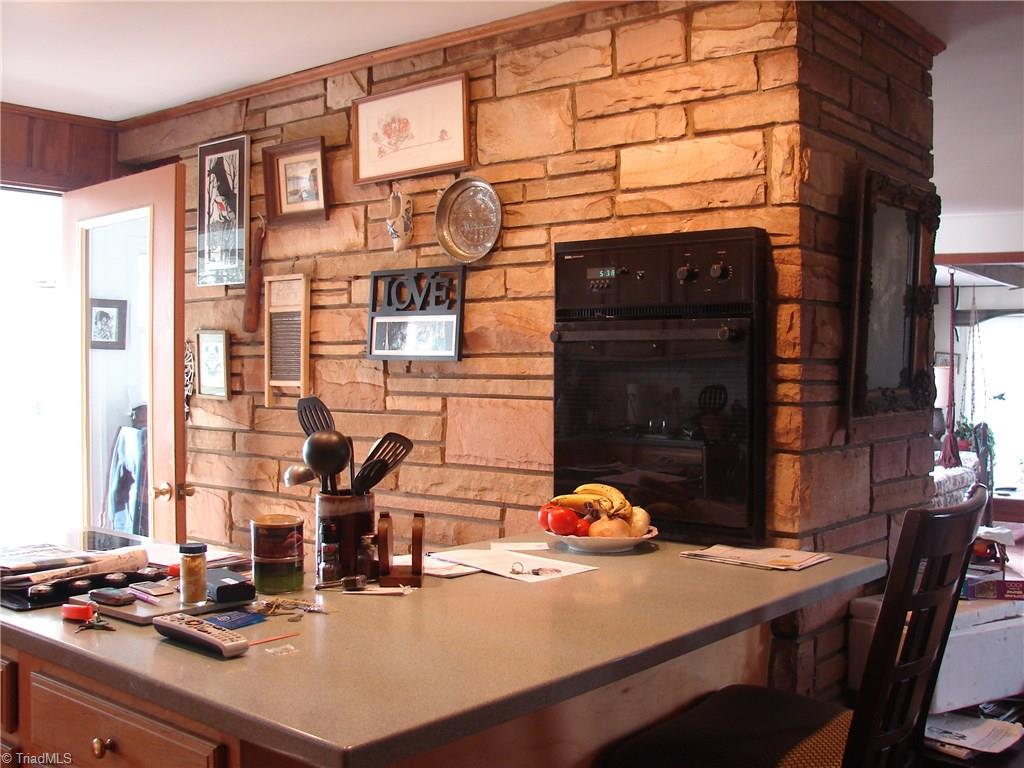 3225 Apperson Road East Bend, NC 27018 - Photo 20 of 23 Kitchen with rock wall to dining room