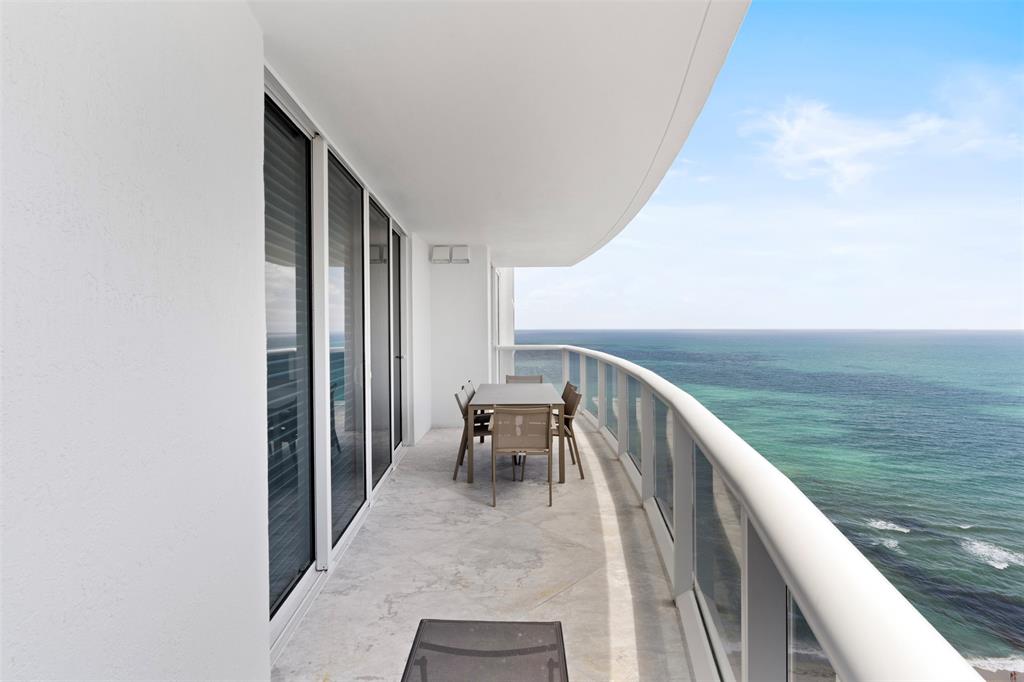 a balcony with view of ocean