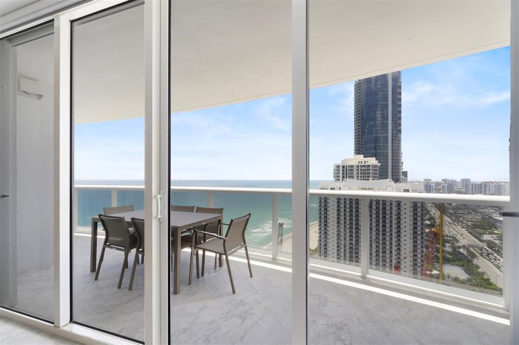 18911 Collins Avenue, Unit 3003 Sunny Isles Beach, FL 33160 - Photo 7 of 53 a view of balcony with furniture