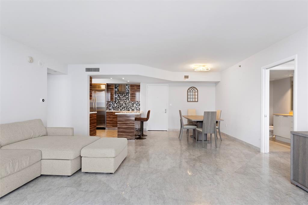18911 Collins Avenue, Unit 3003 Sunny Isles Beach, FL 33160 - Photo 10 of 53 a living room with furniture and a window
