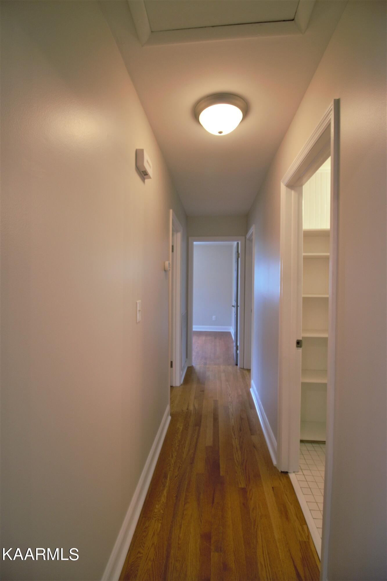 124 West Lincoln Road Oak Ridge, TN 37830 - Photo 17 of 27 a view of a hallway with wooden floor