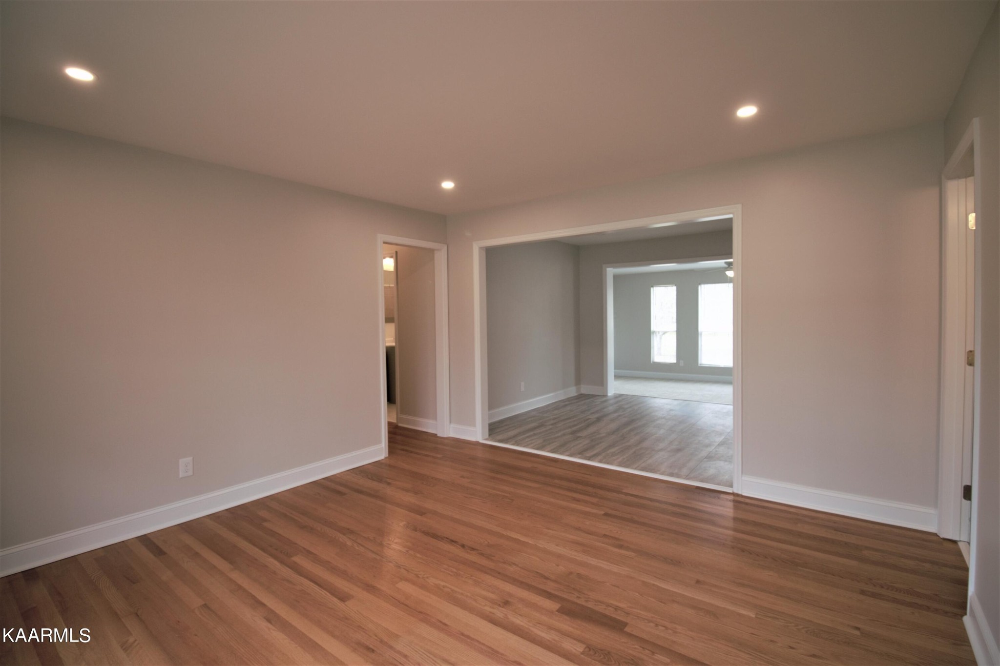 124 West Lincoln Road Oak Ridge, TN 37830 - Photo 19 of 27 a view of an empty room with wooden floor and a window