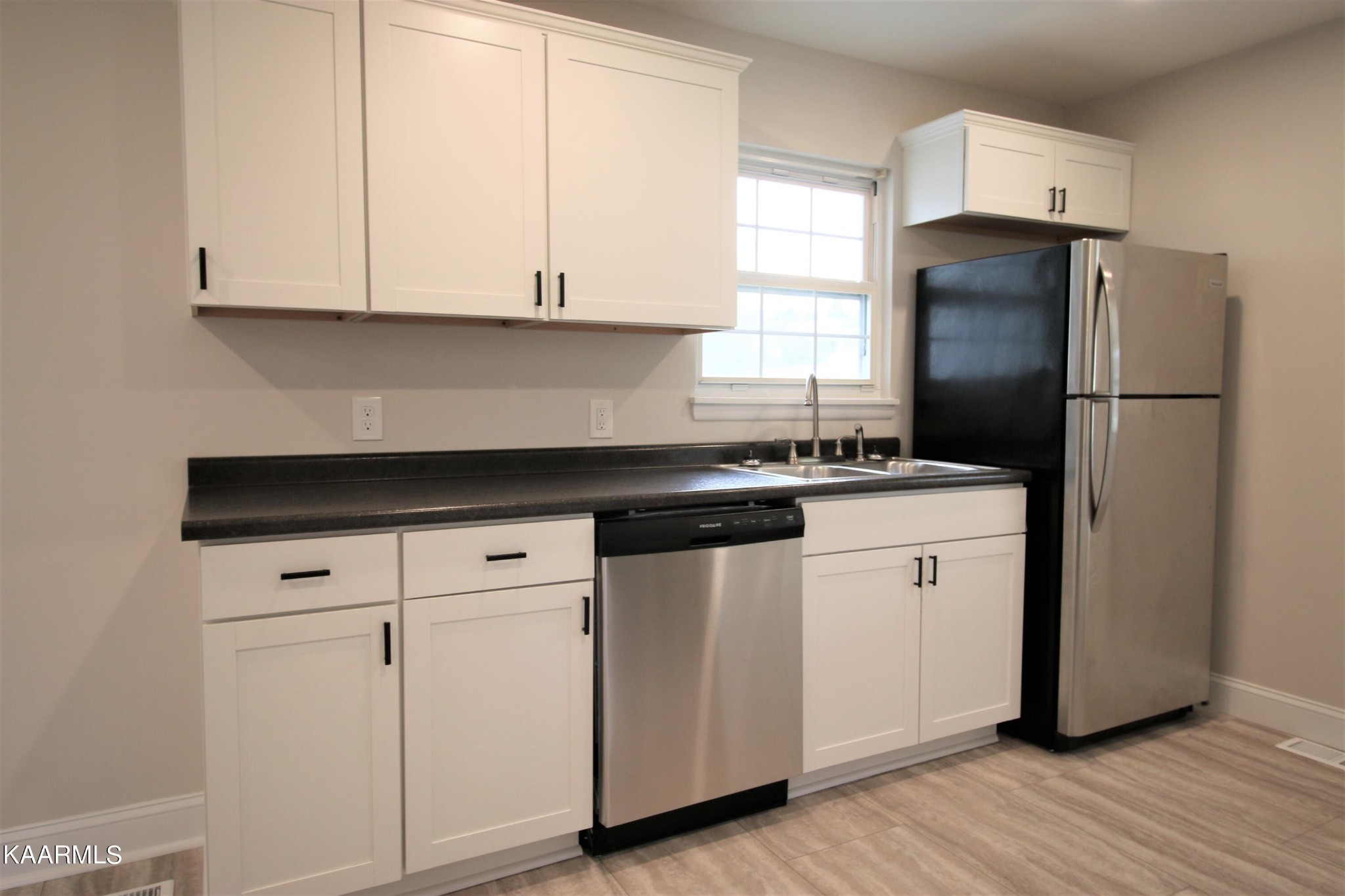 124 West Lincoln Road Oak Ridge, TN 37830 - Photo 24 of 27 a kitchen with appliances a sink and a window