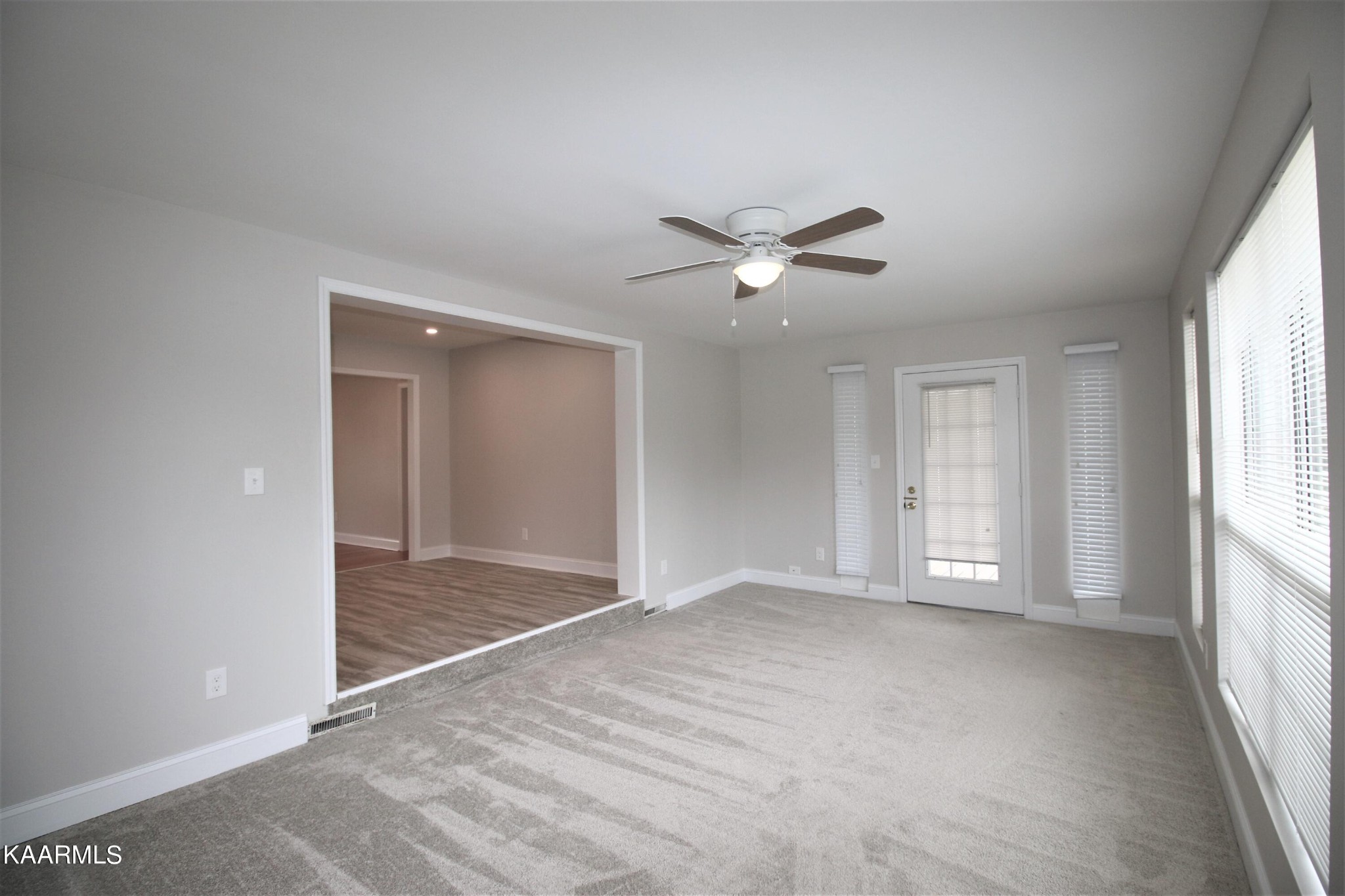 124 West Lincoln Road Oak Ridge, TN 37830 - Photo 25 of 27 an empty room with windows and ceiling fan