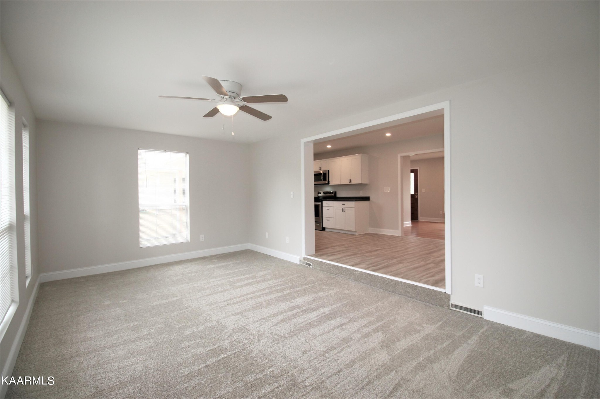 124 West Lincoln Road Oak Ridge, TN 37830 - Photo 4 of 27 a view of empty room with a kitchen and a window