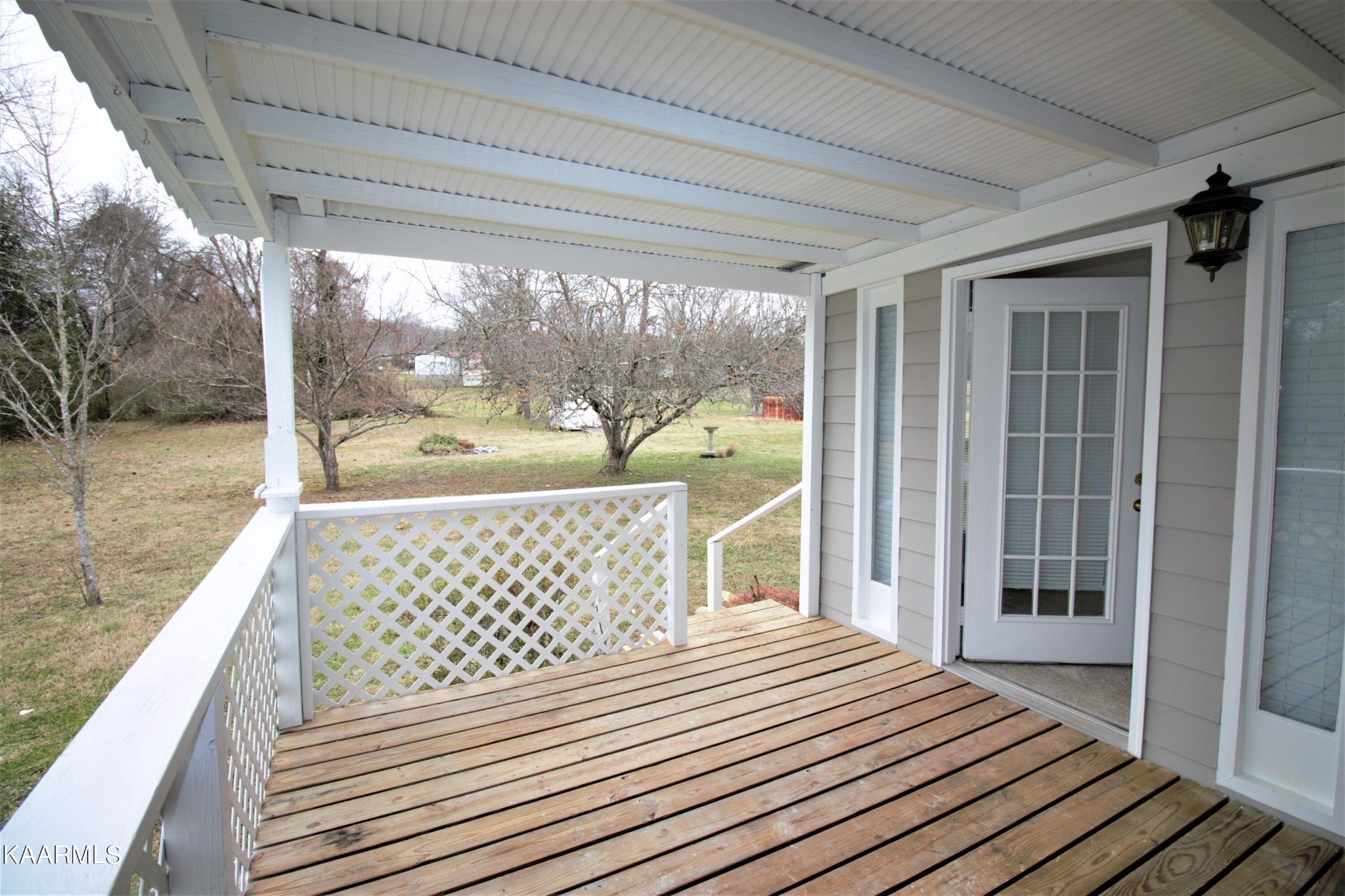 124 West Lincoln Road Oak Ridge, TN 37830 - Photo 8 of 27 a bedroom with a bed and a large window