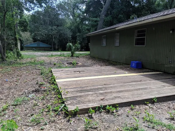 a backyard of a house with lots of green space