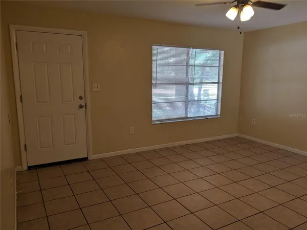 a view of an empty room and window