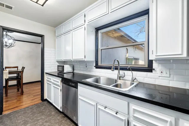 a kitchen with a sink and cabinets