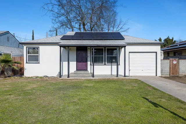 a view of a house with a garden