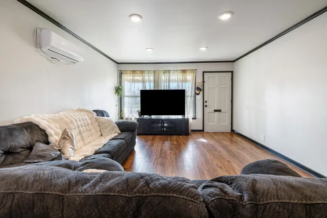 a living room with a couch and a flat screen tv