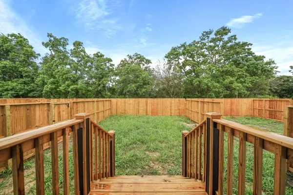 a view of outdoor space with deck and yard