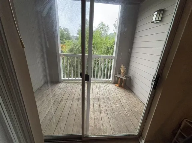 a utility room with washer and white refrigerator