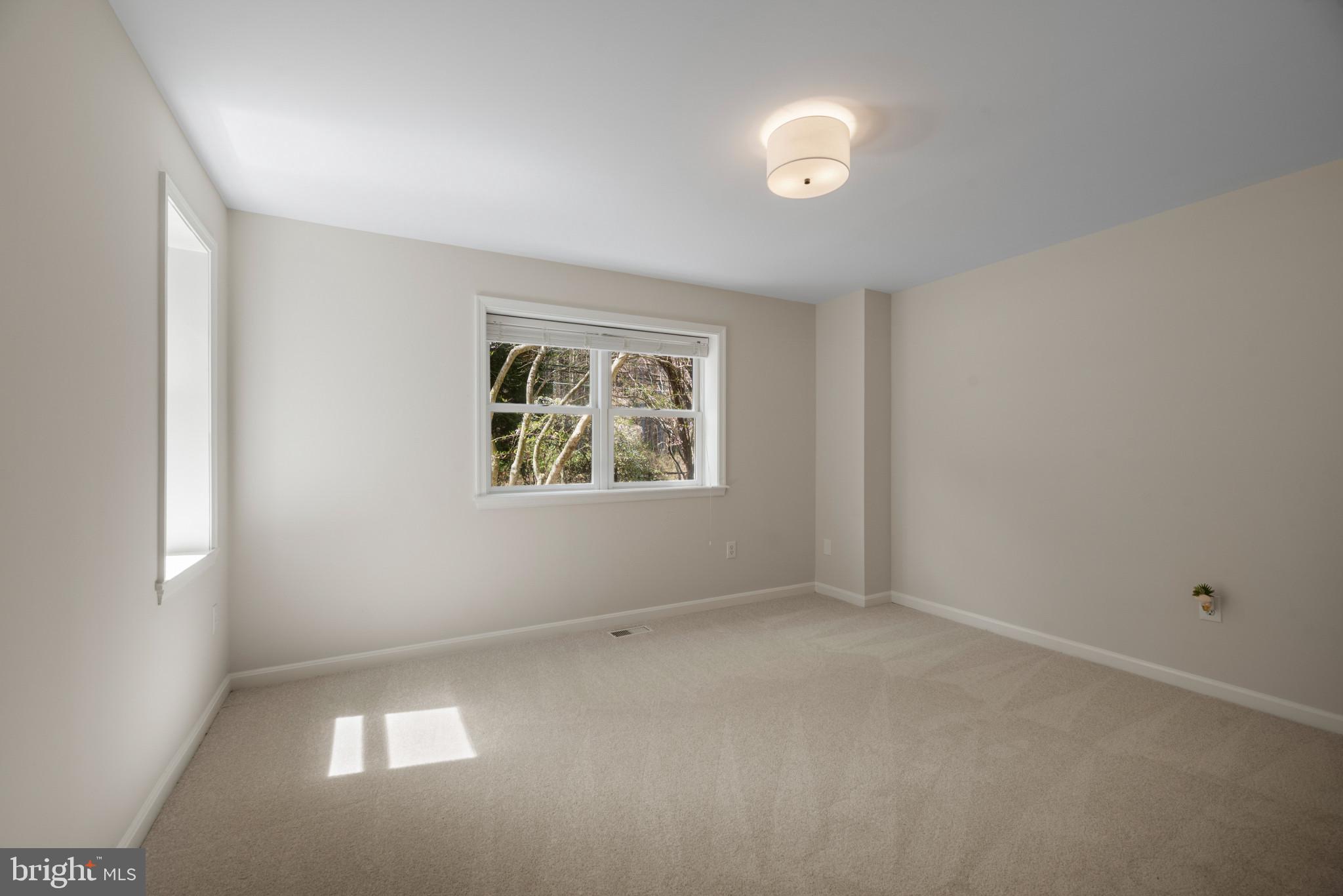 5929 Deale Beach Road Deale, MD 20751 - Photo 22 of 58 Empty room featuring light carpet and baseboards